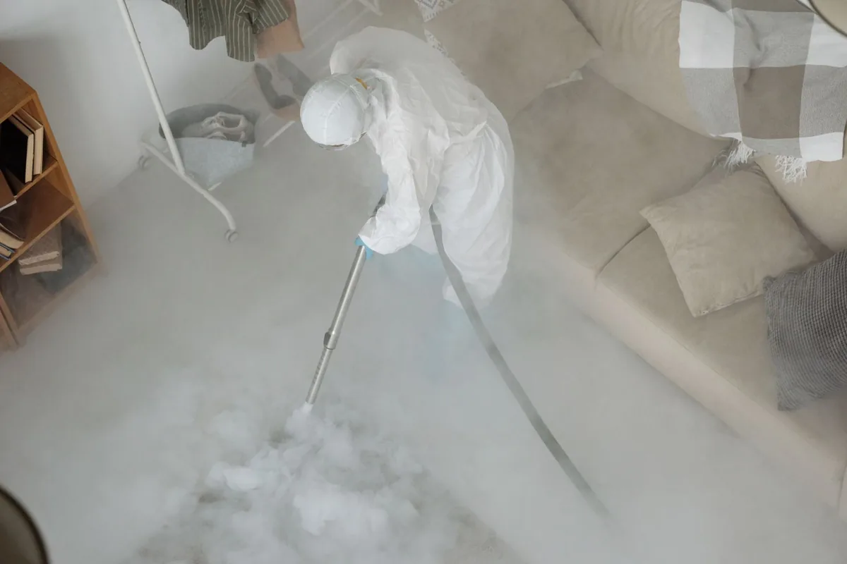 Biohazard cleanup technician in protective equipment, Holland, NY